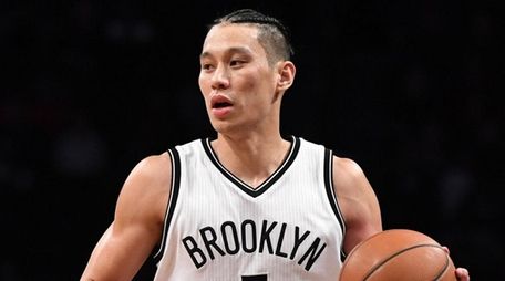 Nets guard Jeremy Lin controls the ball against