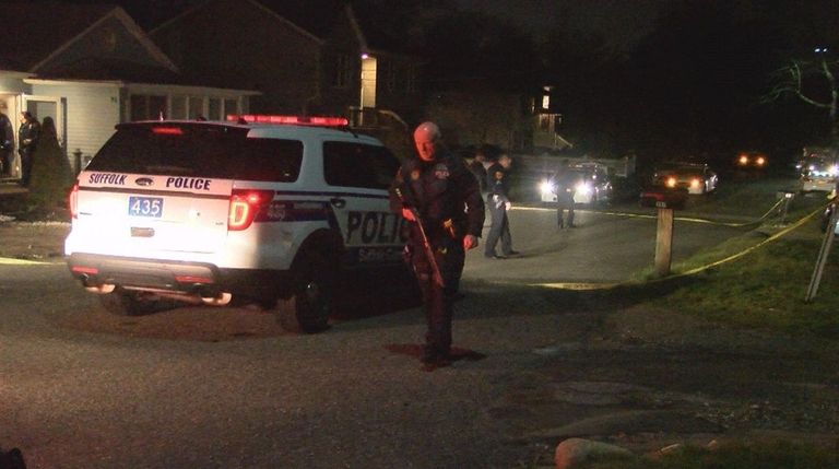 Suffolk County police officers respond to a home