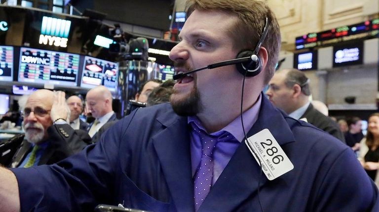 Trader Michael Milano works on the floor of