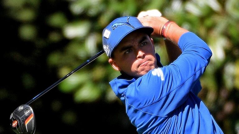 Rickie Fowler follows through on his drive from