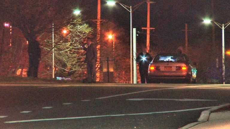 Investigators at the scene where Suffolk police said