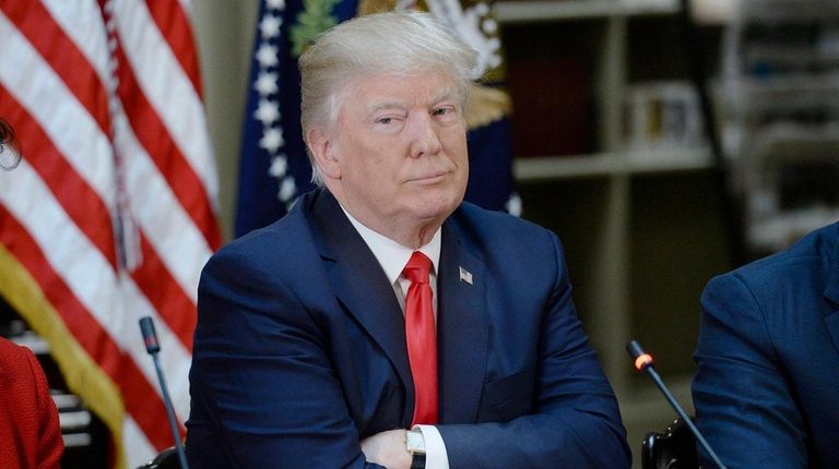 U.S. President Donald Trump, listens during a strategic