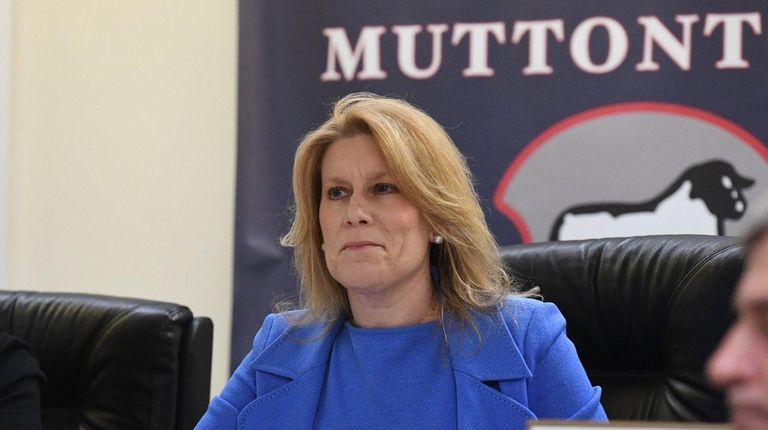 Muttontown Mayor Julianne Wesley Beckerman listens during a