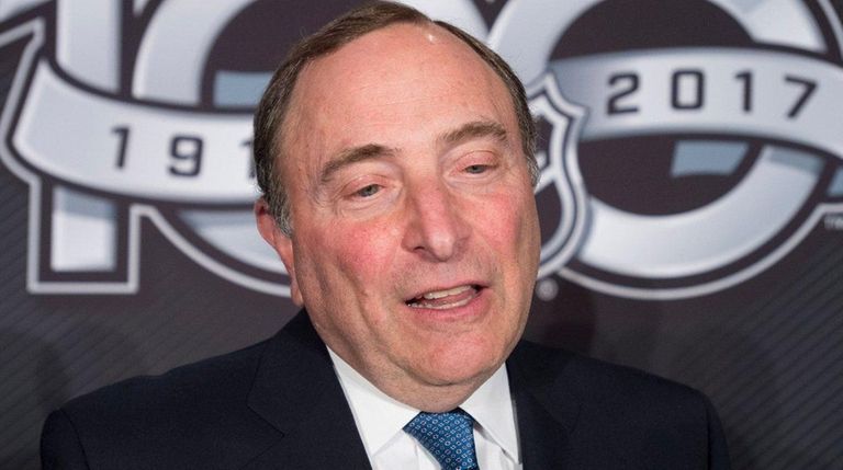 NHL Commissioner Gary Bettman speaks with the media