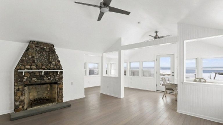 The main house features a stone fireplace. Both