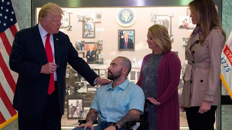 President Donald Trump awards a Purple heart to
