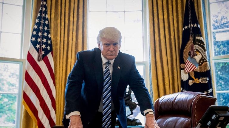 President Donald Trump poses for a portrait in