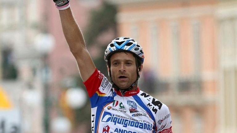 Michele Scarponi crosses the finish line of the