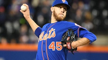 New York Mets starting pitcher Zack Wheeler delivers