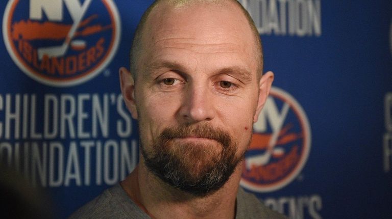 New York Islanders defenseman Dennis Seidenberg answers questions