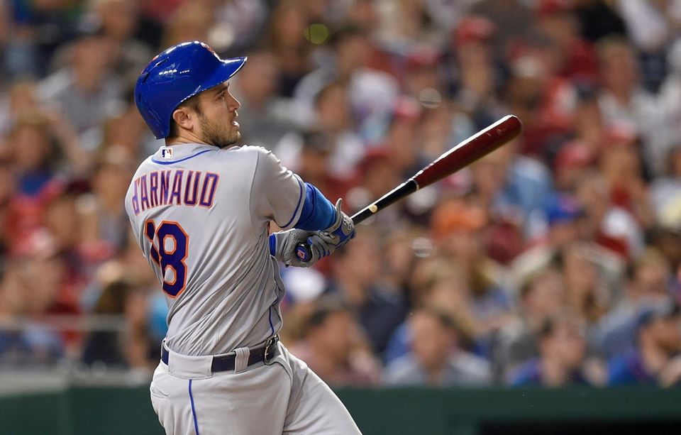 New York Mets' Travis d'Arnaud watches his three-run