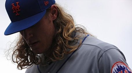 Noah Syndergaard of the Mets walks off