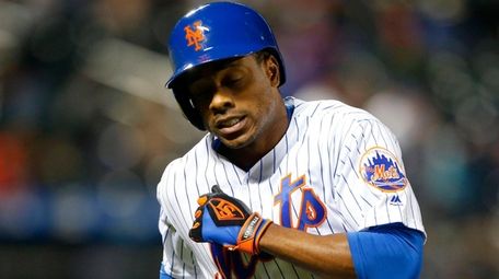 Curtis Granderson of the Mets reacts after flying