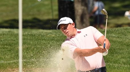 Scott Stallings chips onto a practice green from