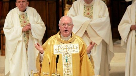 Bishop George Niederauer leads Mass in the Cathedral