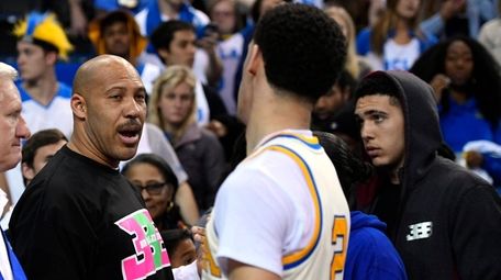 UCLA guard Lonzo Ball, right, shakes hands with