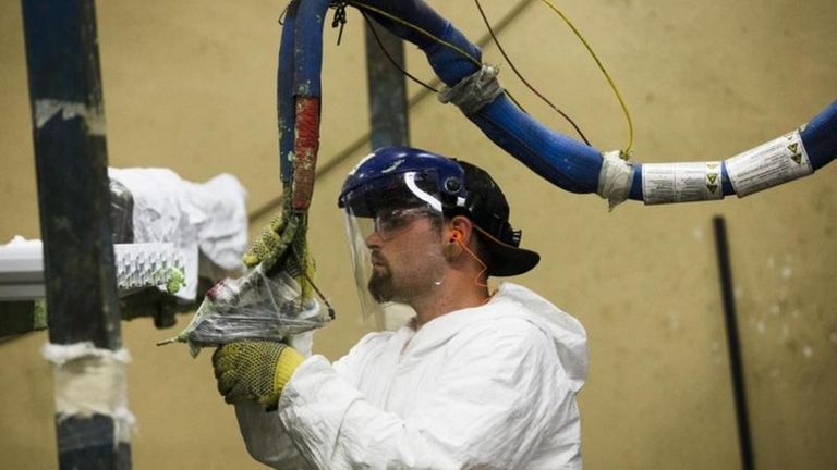 This worker assembles construction supplies on Aug. 7,
