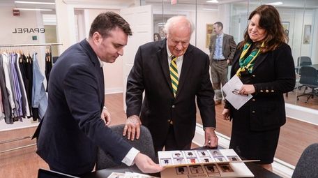 Kevin Schiesz, CEO of uniform company eParel, shows
