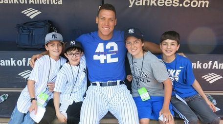 Aaron Judge with Kidsday reporters Andrew Galligan, left,