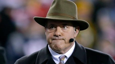 ESPN broadcaster Chris Berman walks on the sideline