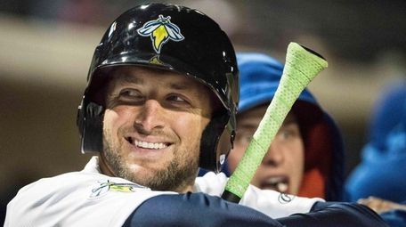 Columbia Firefly outfielder Tim Tebow shares a smile