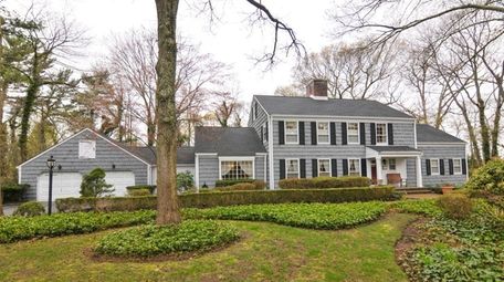 This five-bedroom, 4½-bath Colonial in Smithtown is listed