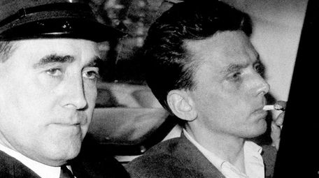 Ian Brady, at right, arrives at court in