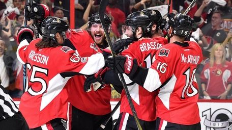 Marc Methot of the Ottawa Senators celebrates with
