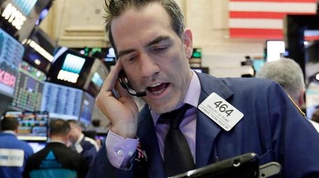 Trader Gregory Rowe works on the floor of