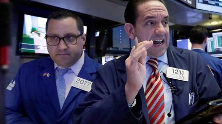 Specialist Brian Fairbrother, left, and trader Tommy Kalikas