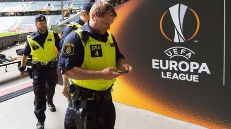 Police walk through a tunnel inside the Friends