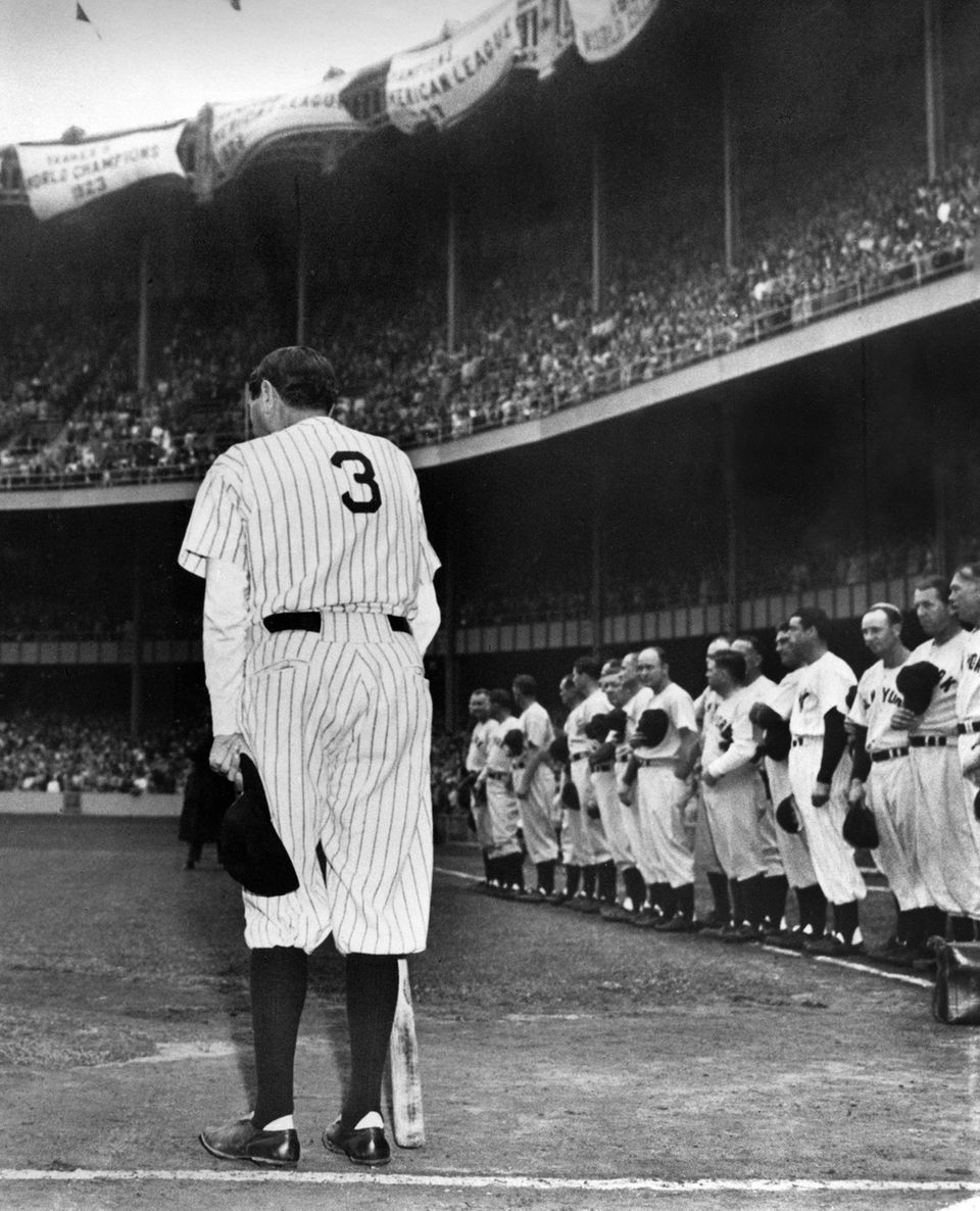Home run king Babe Ruth, wearing his famed