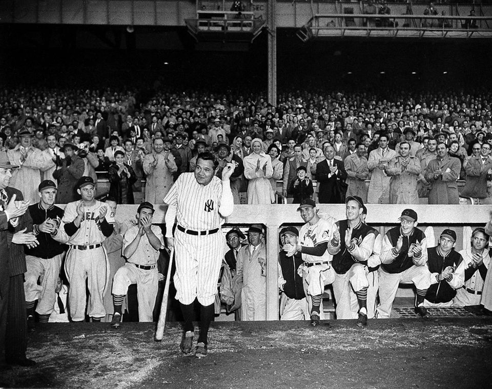 Babe Ruth, wearing his No. 3 uniform, receives