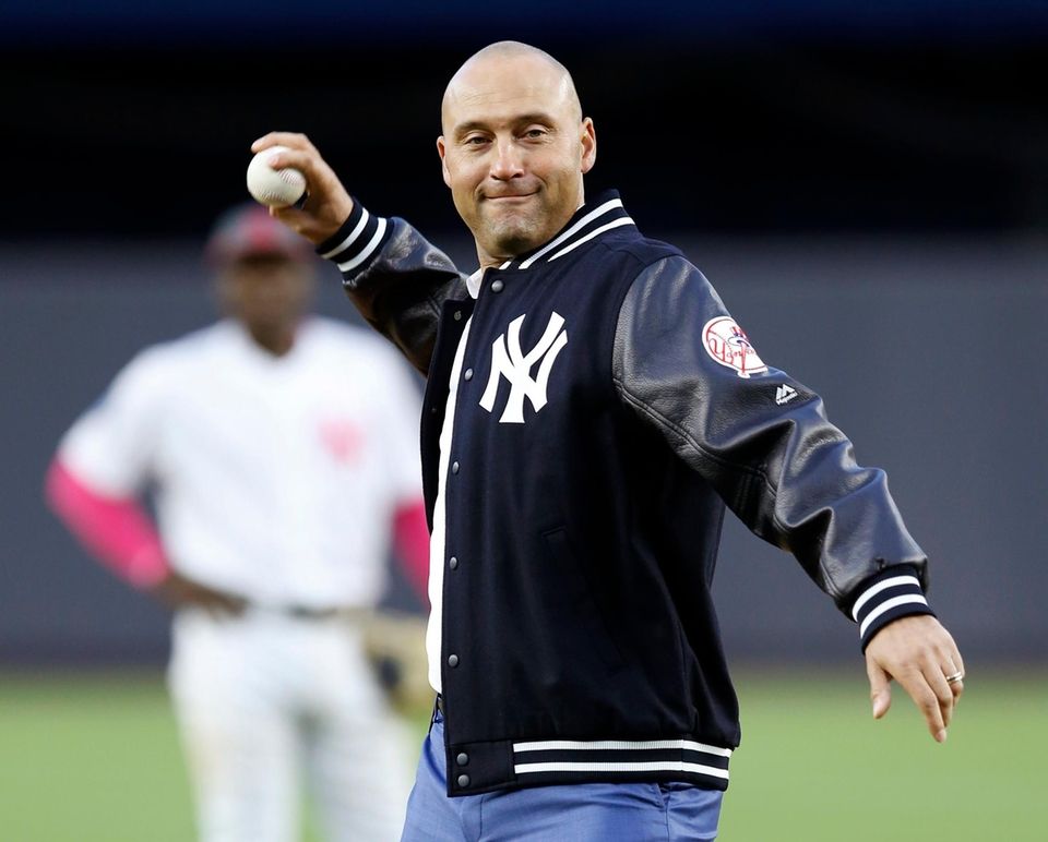 Retired New York Yankees shortstop Derek Jeter throws