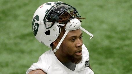 New York Jets' ArDarius Stewart looks on between