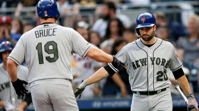 New York Mets' Jay Bruce is greeted by