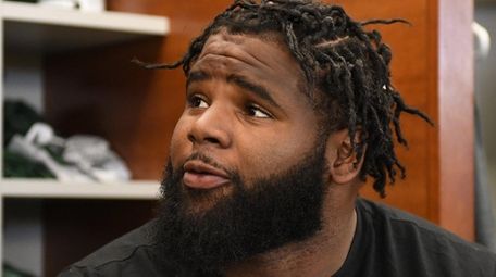 Sheldon Richardson speaks to reporters in the
