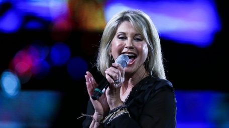 Olivia Newton-John has postponed her eight scheduled June