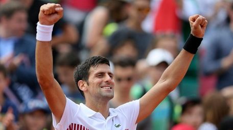 Serbia's Novak Djokovic celebrates after defeating Portugal's Joao