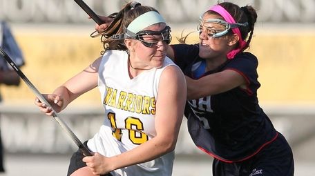 Wantagh's Kayla Conway (16) carries the ball while