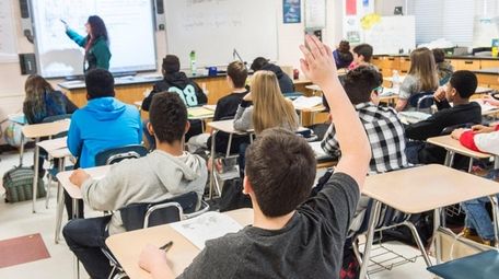 Eighth grade students in a classroom.