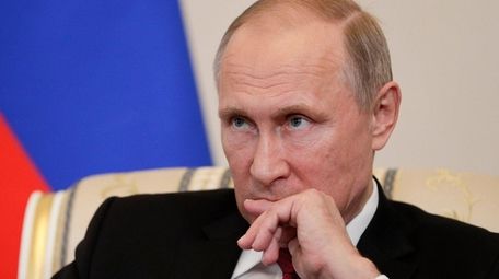 Russian President Vladimir Putin attends a meeting at