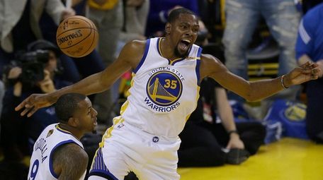 Golden State Warriors forward Kevin Durant reacts after