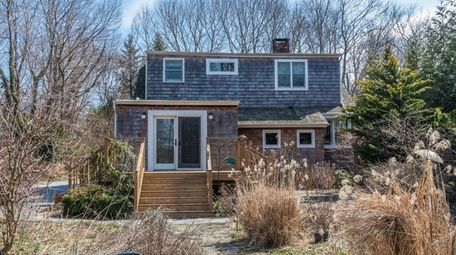 This updated three-bedroom, two-bath Stony Brook Craftsman-style home