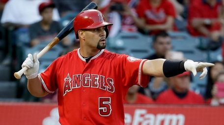 Los Angeles Angels' Albert Pujols points after a