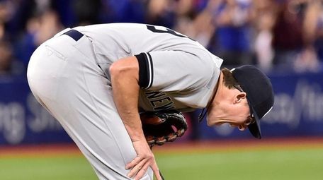 New York Yankees relief pitcher Tyler Clippard reacts