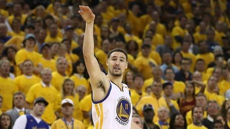 Klay Thompson of the Golden State Warriors watches