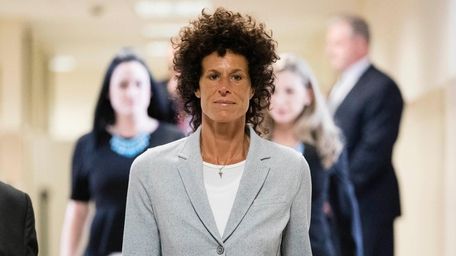 Andrea Constand walks to the courtroom during Bill