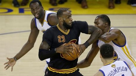 Cleveland's LeBron James drives . . . ahem