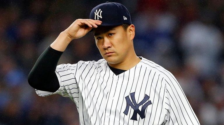 Masahiro Tanaka of the New York Yankees walks